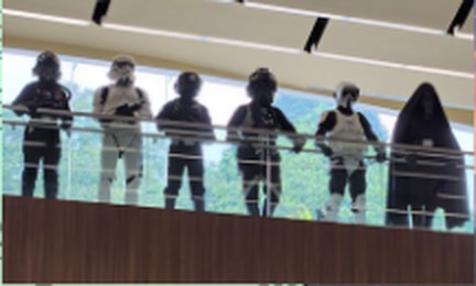 A row of costumed Star Wars troopers on a mall balcony