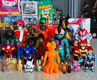 A shelf of Japanese vintage toys and collectible figures